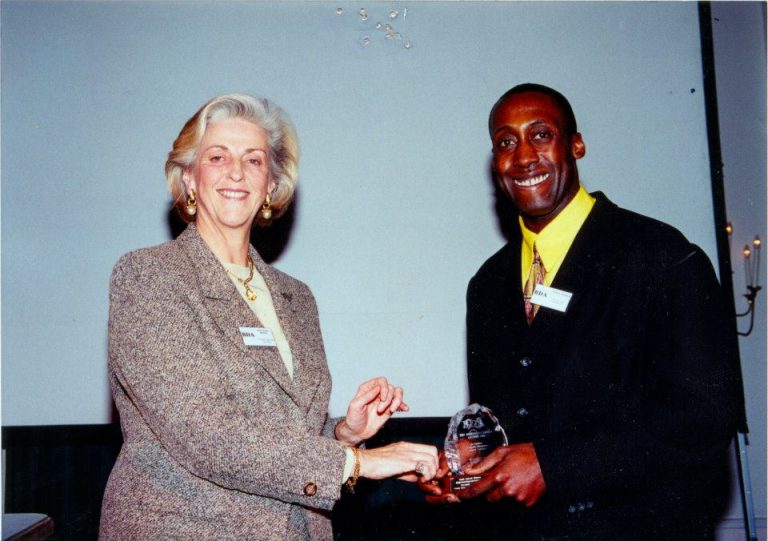 Photo is of site owner Fitzroy Andrew receiving an award from Lady Diana Brittn at the British Diversity Award ceremony in November 1996